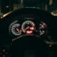 a car dashboard with a speedometer