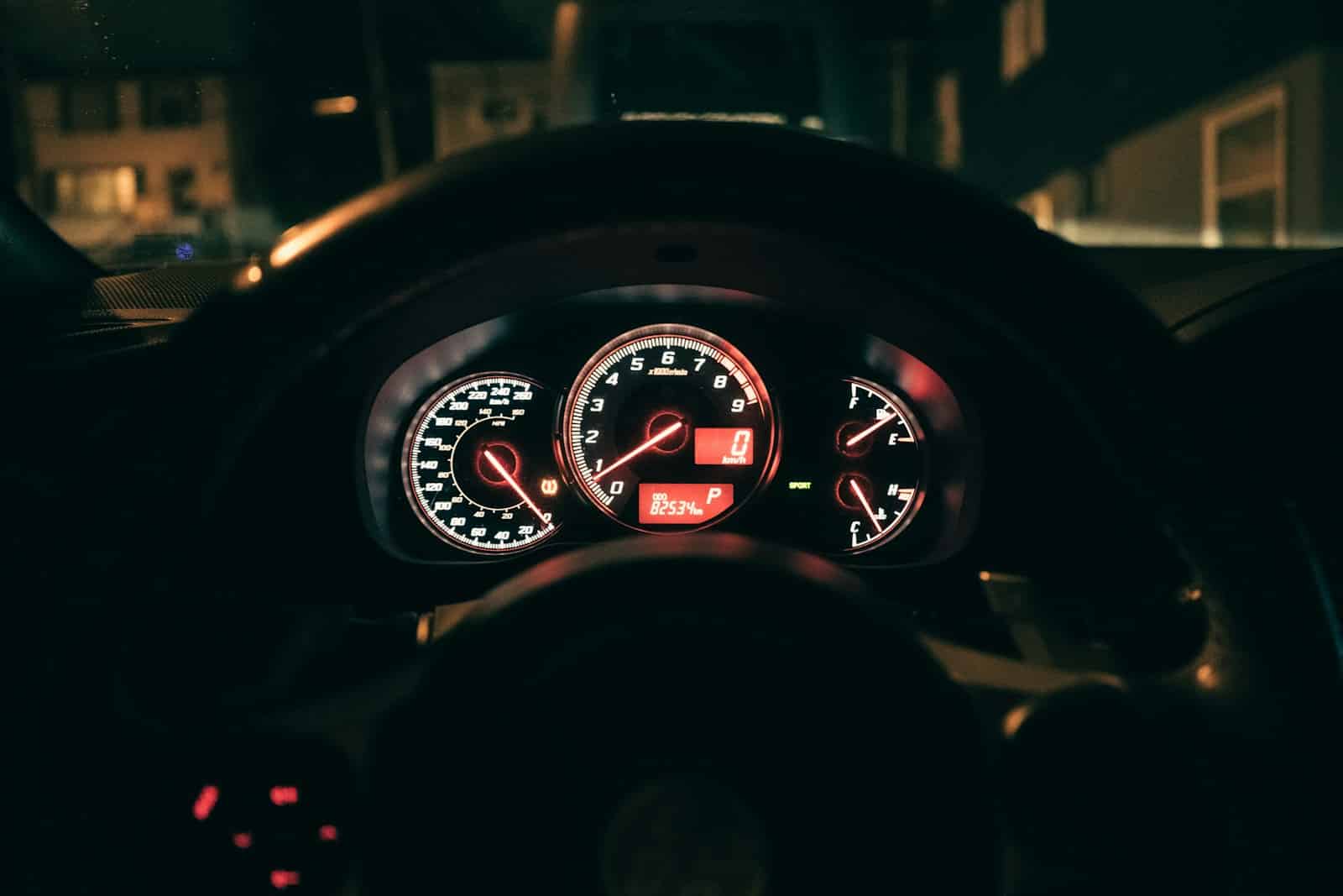 a car dashboard with a speedometer