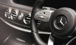 a steering wheel and dashboard of a car