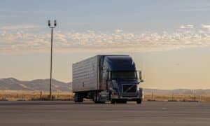 black truck on road during daytime
