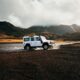 white car crossing body of water