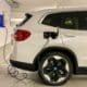 an electric car plugged in to a charging station