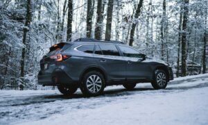 black suv on snow covered ground