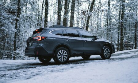 black suv on snow covered ground