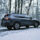 black suv on snow covered ground