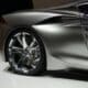 a silver sports car on display at a show
