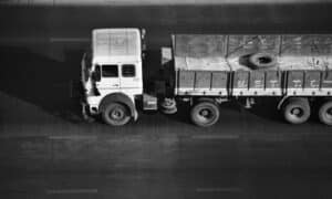 a black and white photo of a truck