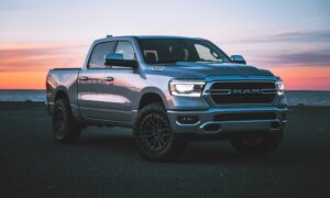 a silver ram truck parked in a parking lot