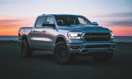 a silver ram truck parked in a parking lot