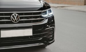 a close up of the front of a black volkswagen suv
