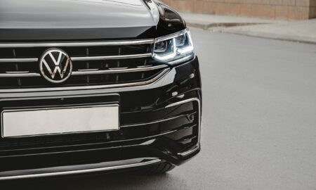 a close up of the front of a black volkswagen suv