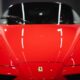 a red sports car parked in a garage