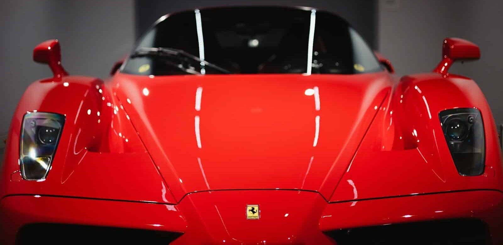 a red sports car parked in a garage