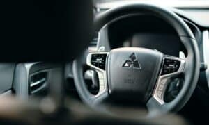 black honda steering wheel in close up photography