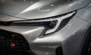 a close up of the front of a silver car