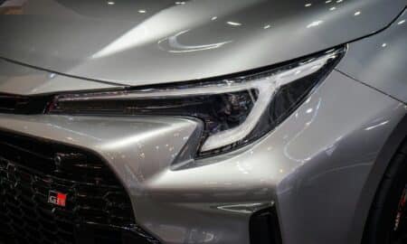 a close up of the front of a silver car