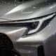 a close up of the front of a silver car