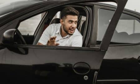 a person sitting on the seat of a car