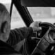 Man driving a car on a blurry day
