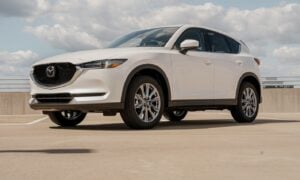 a white mazda cx - 5 parked in a parking lot