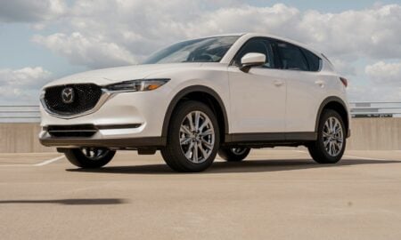 a white mazda cx - 5 parked in a parking lot