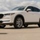 a white mazda cx - 5 parked in a parking lot