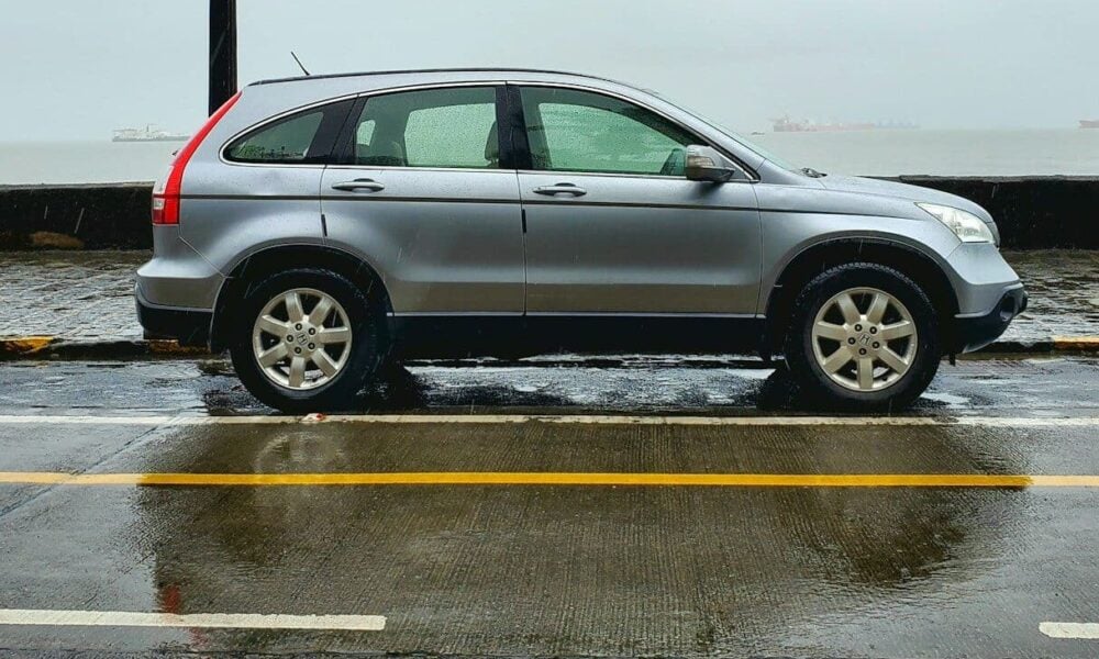 gray suv on gray asphalt road during daytime