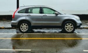 gray suv on gray asphalt road during daytime