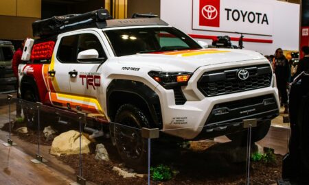White toyota trd truck with colorful graphics on display