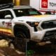 White toyota trd truck with colorful graphics on display
