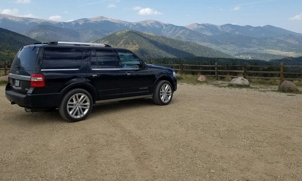 black suv on brown field during daytime