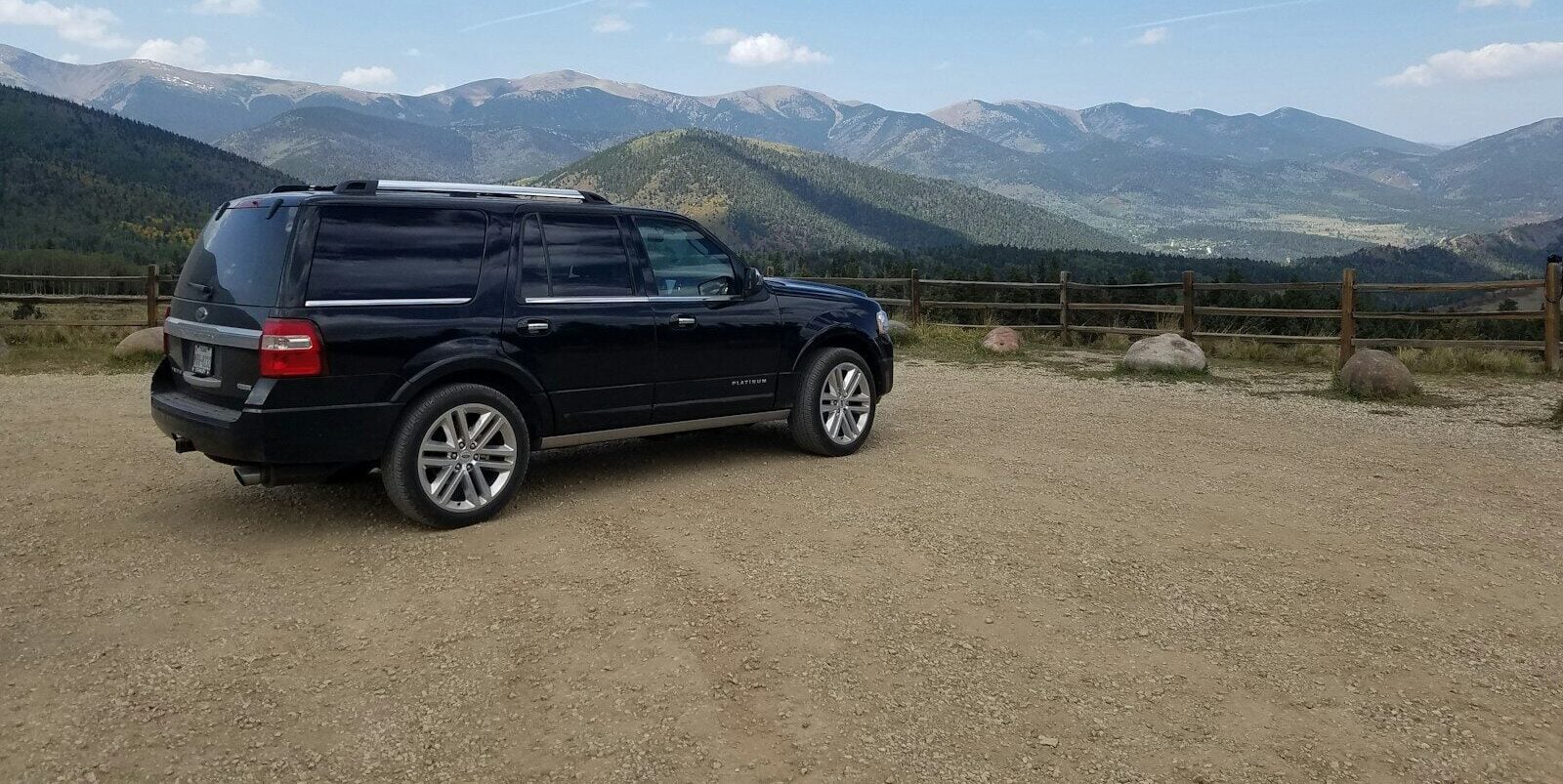 black suv on brown field during daytime