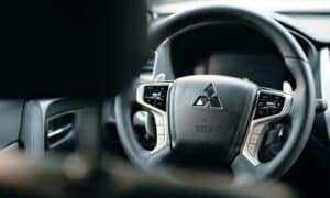 black honda steering wheel in close up photography