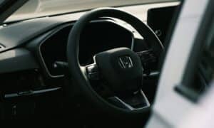 a steering wheel and dashboard of a car