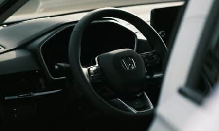 a steering wheel and dashboard of a car