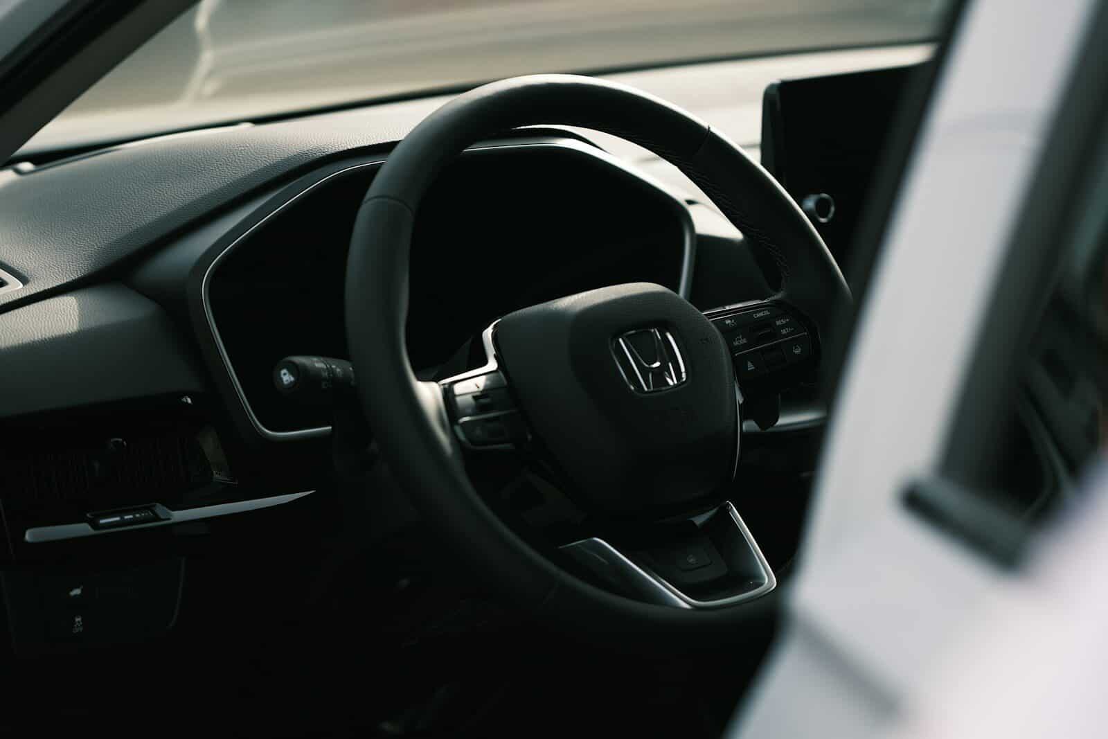 a steering wheel and dashboard of a car