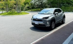 Modern silver suv parked in a sunny outdoor lot