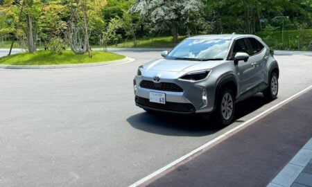 Modern silver suv parked in a sunny outdoor lot