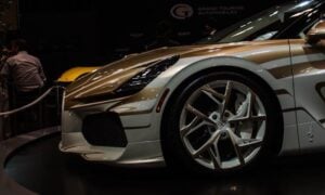 A custom sports car with unique gold accents on display