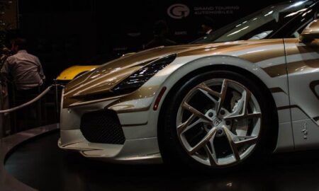 A custom sports car with unique gold accents on display
