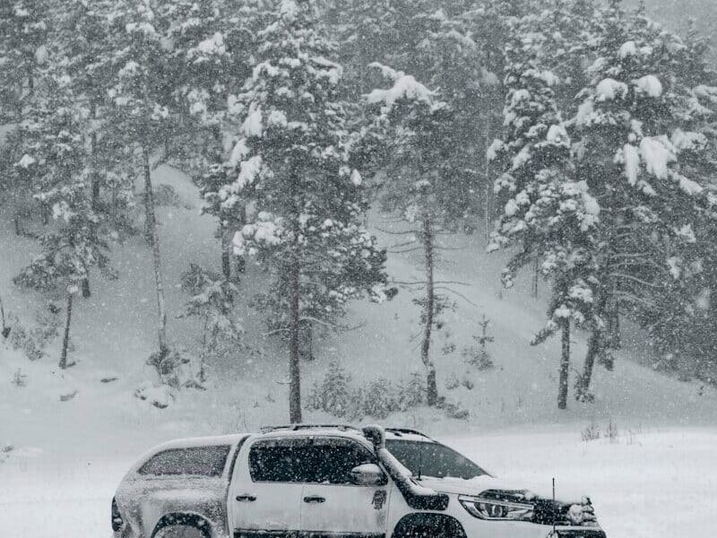 a truck is parked in a snowy field