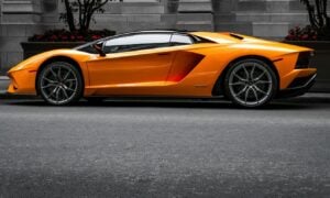 orange sports car on roadway