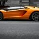 orange sports car on roadway