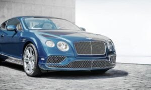 blue coupe on road