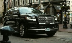 a black car parked on the side of the road