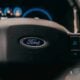 a close up of the steering wheel of a car