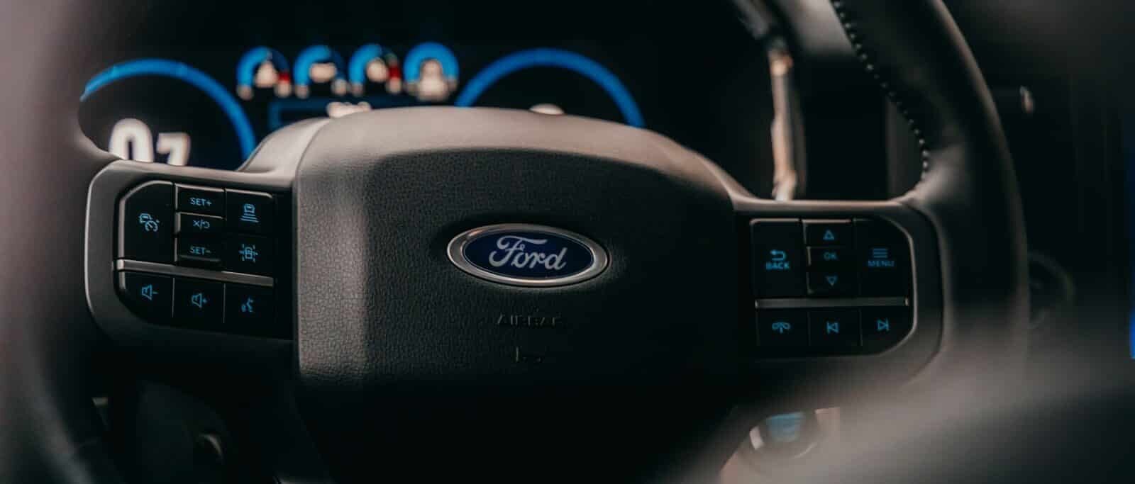 a close up of the steering wheel of a car