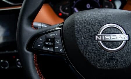 Close-up of a nissan steering wheel with controls