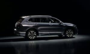 Dark blue suv parked on a reflective surface