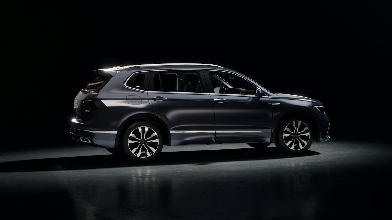 Dark blue suv parked on a reflective surface